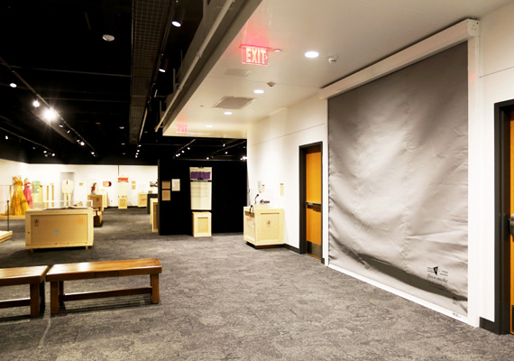 Fire curtain deployed across a doorway inside an exhibit hall