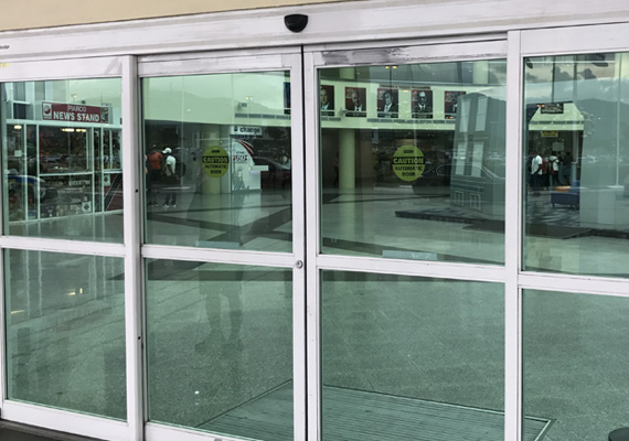 Automatic sliding glass entrance doors at a building entrance