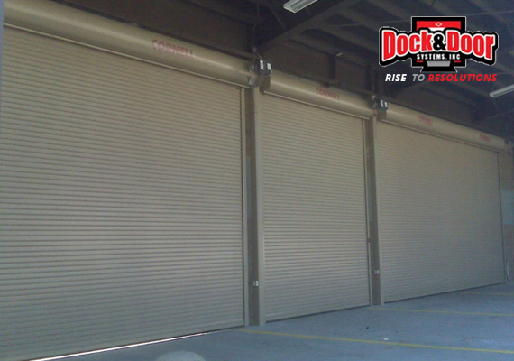 Row of rolling coiling doors inside a warehouse loading area