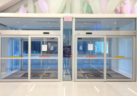 Automatic sliding glass entrance doors in a building lobby