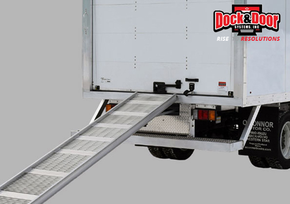 Aluminum walk ramp deployed from the back of a delivery truck